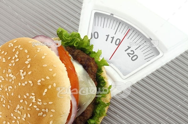 ﻿عکس تبلیغاتی غذا و ترازو چاقی