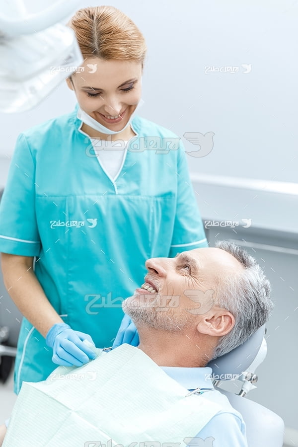 عکس دندانپزشک و بیمار