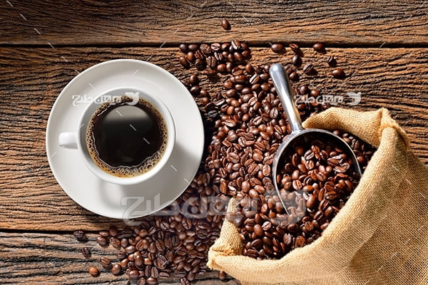 عکس دانه های قهوه و فنجان قهوه