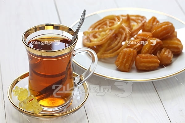 تصویر استکان چای زولبیا و بامیه